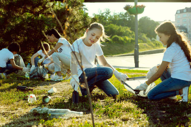 istock Warm-hearted friends gathering glass rubbish 1004848784