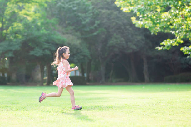 istock Girl playing on the lawn 1004859488