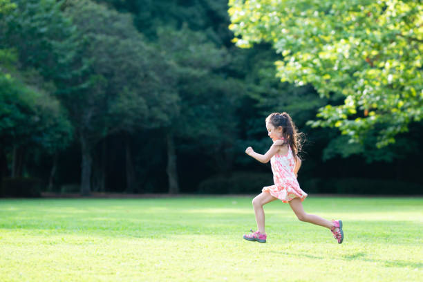 istock Girl playing on the lawn 1004859490