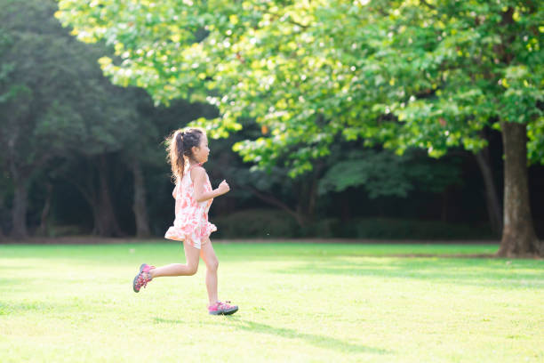 istock Girl playing on the lawn 1004859492