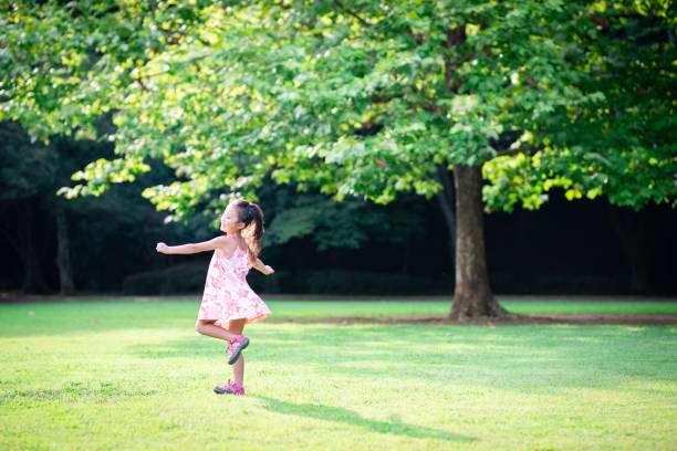 istock Girl playing on the lawn 1004859494