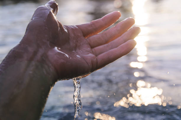 istock water drains from the palm of the hand 1004862110