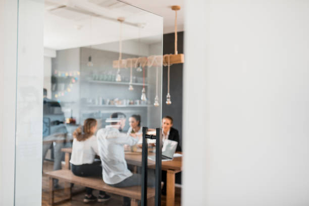 istock Businesspeople taking a break in the kitchen 1004862304