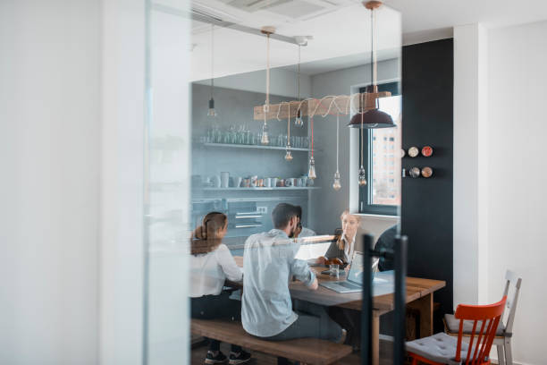 istock Businesspeople taking a break in the kitchen 1004862306