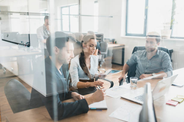 istock Three businesspeople discussing their pitch 1004862312