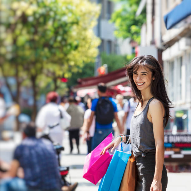 istock Woman with shopping bags 1004865114