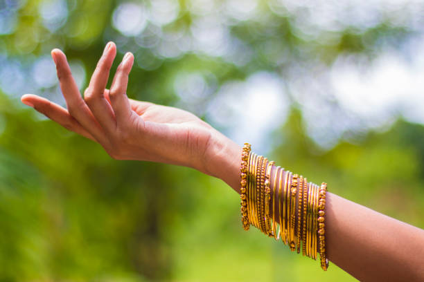 istock beautiful lady hand with ornaments 1004883110