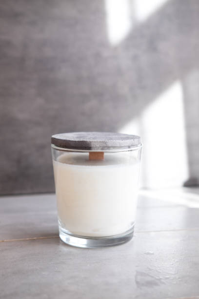 istock Concrete scented soy round candle on grey table 1004889926