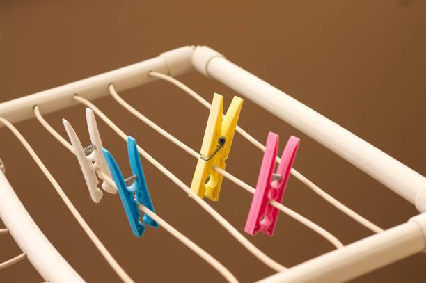 istock Isolated colored clothespins on the clotheshorse (Pesaro, Italy, Europe) 1004890720