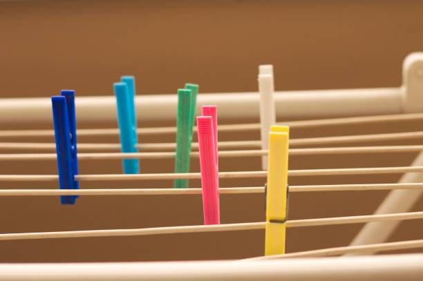 Isolated colored clothespins on the clotheshorse (Pesaro, Italy, Europe)