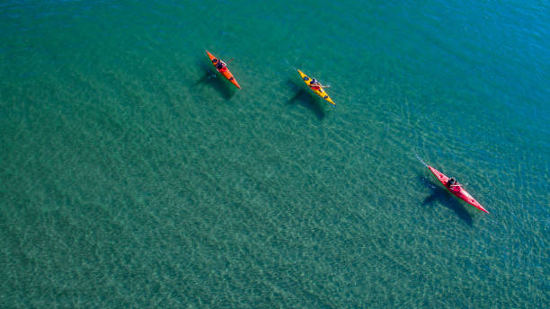 istock High Angle View Of People Kayaking In Sea 1004894470