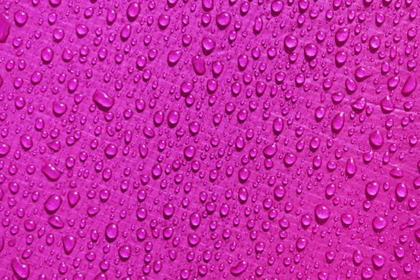 istock pink waterproof material, rip stop cloth with drops of water 1004901476