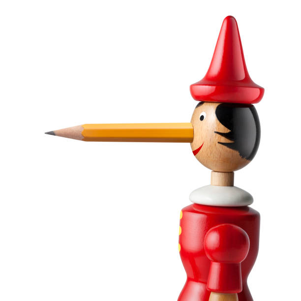 istock Pinocchio with a pencil nose on white background 1004902092