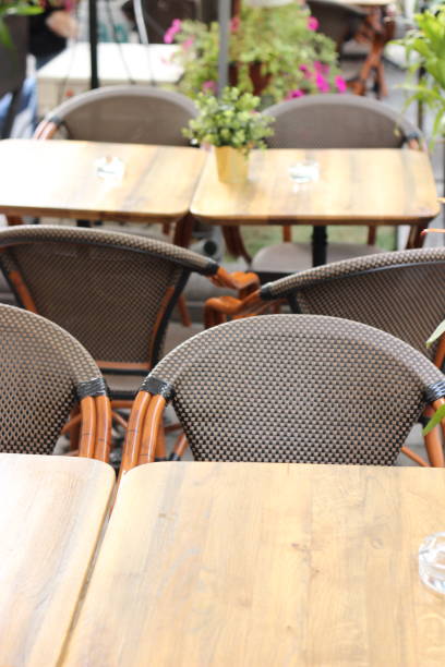 istock Wooden cafe outdoors chairs 1004908144
