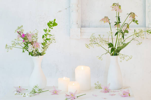 istock white vintage interior with flowers and candles 1004922504