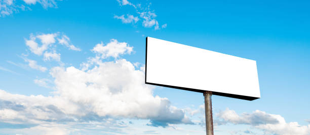 blank billboard on sky background - billboard posting showing billboard commercial sign imagens e fotografias de stock