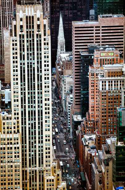 istock 5th Avenue Passing St Patrick's Cathedral Going through Midtown Manhattan, New York 1004948798