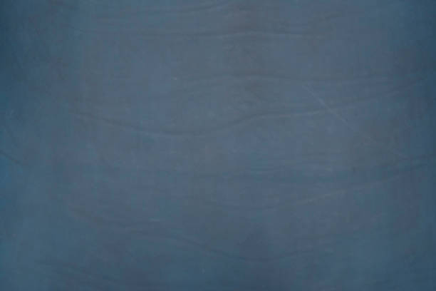 istock Navy blue, dark blue colored vegetable tanned leather texture background. 1004948854