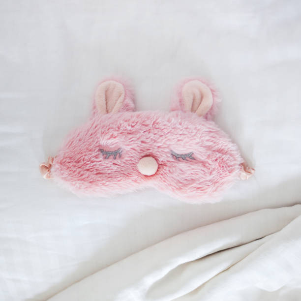 istock Sleeping mask on the bed. Healthy sleep 1004955304
