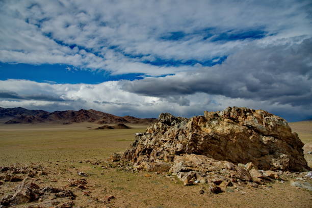 istock The endless steppe is surrounded by mountain ranges. 1004960838