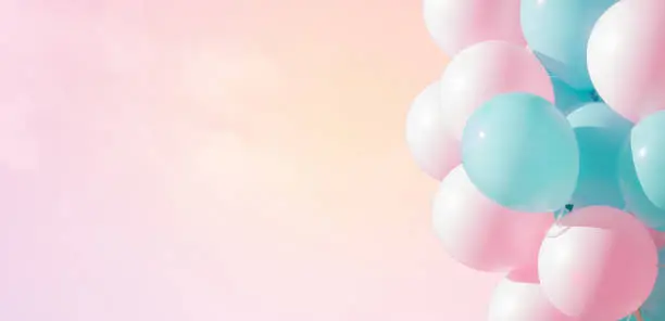 Photo of Beautiful panoramic background with pink and blue balloons