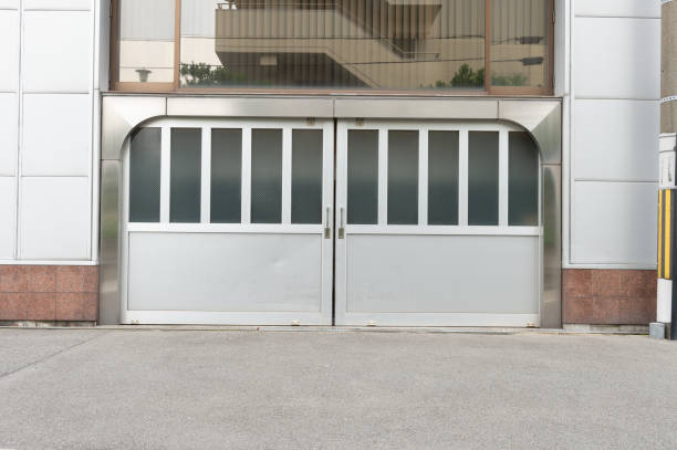 istock sidewalk by street wall & door 1004972980