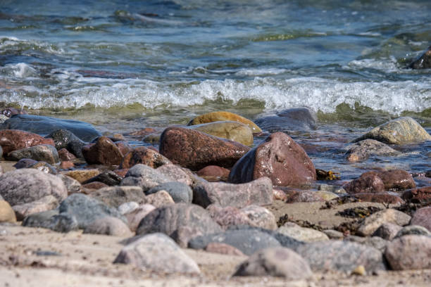 istock rocky sea beach with waves and sunny day 1004981666
