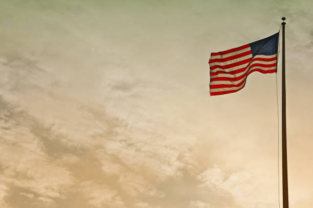 istock united states flag blowing in wind 1004981696