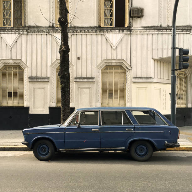 istock Vintage blue car parked in the street 1004986962