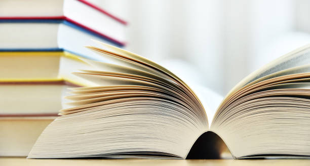 istock Books lying on the table in the public library 1004999150