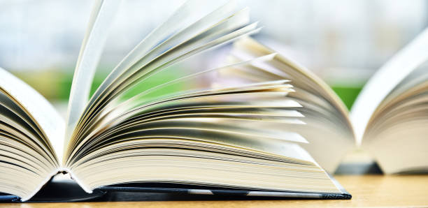 istock Books lying on the table in the public library 1004999202