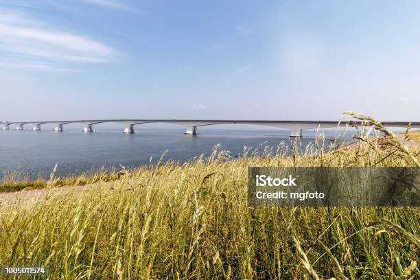 The Zeeland Bridge In Zeeland The Netherlands From The Dyke Near Colijnsplaat Stock Photo - Download Image Now