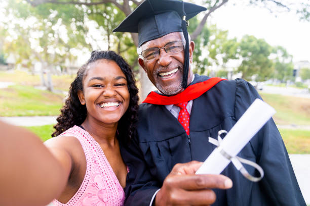 Senior Black Man Graduate with his Daughter