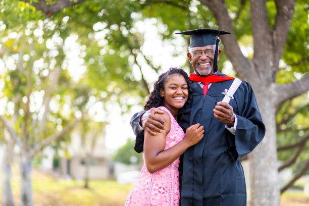 istock Senior Black Man Graduate with his Daughter 1005011768