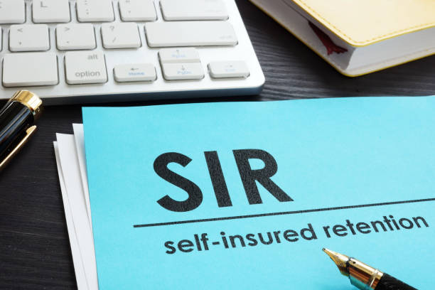 istock Self-insured retention SIR insurance on a desk. 1005014100
