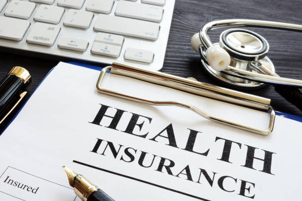 individual health insurance policy and stethoscope. - health insurance imagens e fotografias de stock