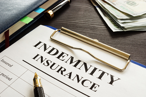 Indemnity insurance policy on the table.