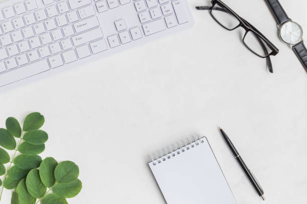 istock Blogger or freelancer workspace with notebook and green leaves 1005014230