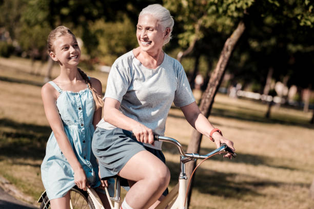 istock Joyful females riding their bicycle 1005014324