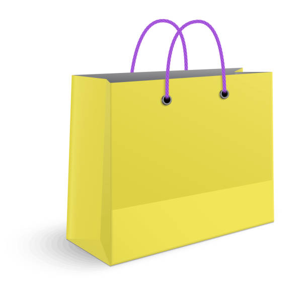 istock Classic shopping yellow bag with violet grips isolated on white 1005016918