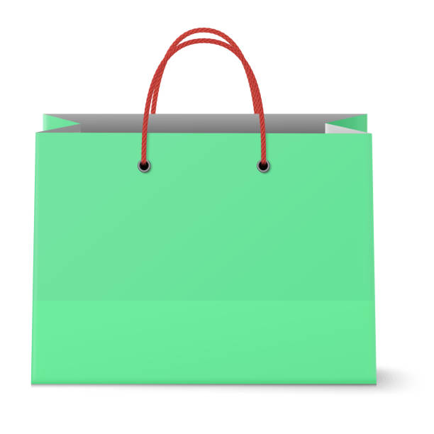 istock Classic paper shopping green bag with red grips background 1005016930