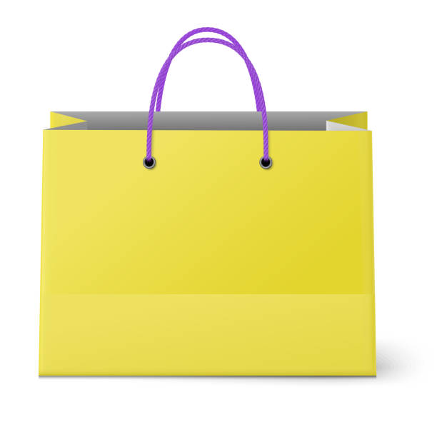 istock Classic shopping yellow bag with violet grips isolated on white background 1005016936