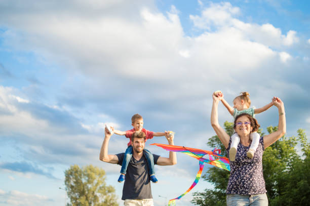 istock Family having fun flying kite 1005027956