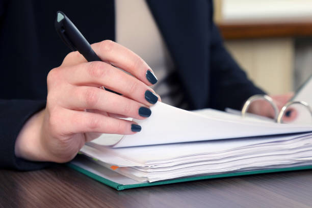 istock hand of business woman with document viewer 1005040232