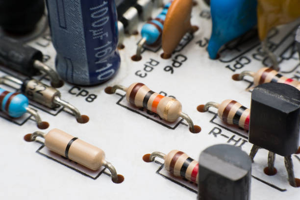 istock Resistor, Capacitor and Transistor on Circuit Board close up. electronic hardware 1005045486