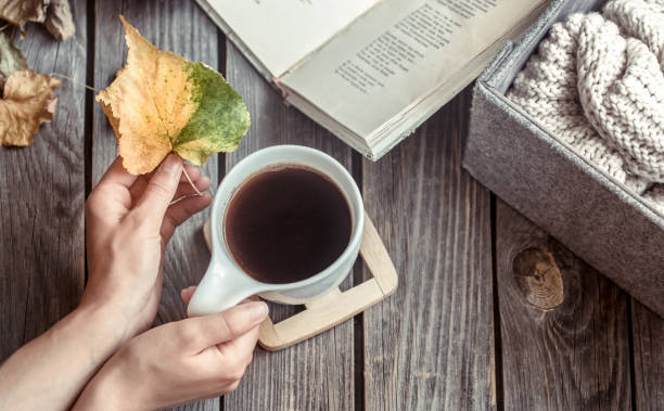 istock Girl with a cup of coffee in hands 1005045828