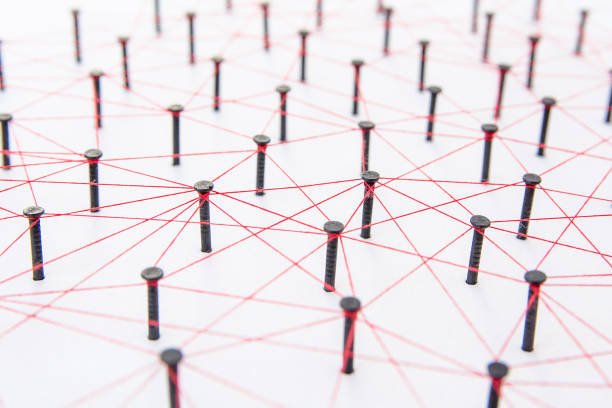 istock Connecting networks concept - network connected with yarn red on white paper with copy space. Simulator connection social media, internet, people communication, Linking entities 1005045852