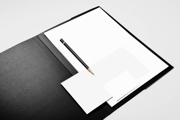 istock Folder, blank sheets of paper, pencil, and business card 1005064410