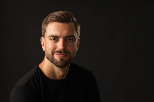 istock studio portrait of a 30 year old man with a beard in the studio on a black background 1005072462