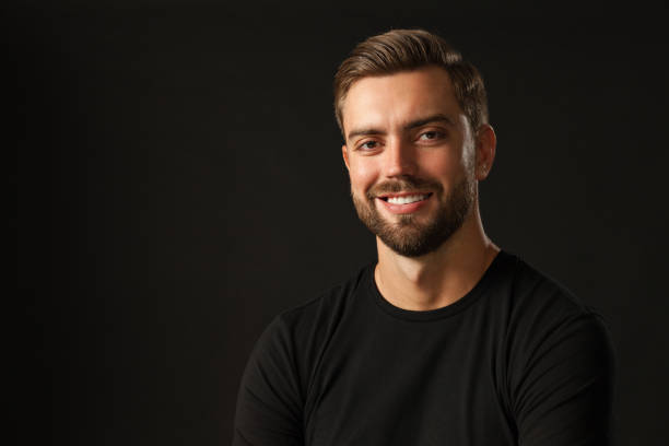 istock studio portrait of a 30 year old man with a beard in the studio on a black background 1005072574